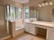 Bathroom featuring a shower, soaking tub, large window, and vanity with plenty of counter space at 31203 N 43Rd St, Cave Creek, AZ 85331