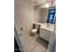 Well-lit half bathroom with a vanity and toilet at 31203 N 43Rd St, Cave Creek, AZ 85331