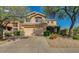 Charming two-story home featuring desert landscaping, a two-car garage, and a welcoming entrance at 31203 N 43Rd St, Cave Creek, AZ 85331