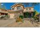 Charming two-story home featuring desert landscaping, a two-car garage, and a welcoming entrance at 31203 N 43Rd St, Cave Creek, AZ 85331