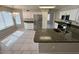 Bright kitchen features white cabinets, stainless steel appliances, and a granite countertop island at 31203 N 43Rd St, Cave Creek, AZ 85331