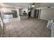 Open concept living area flows into kitchen with granite countertops and modern appliances at 31203 N 43Rd St, Cave Creek, AZ 85331
