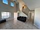 Bright living room with large windows, tile floors, and a high ceiling at 31203 N 43Rd St, Cave Creek, AZ 85331