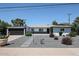 Charming single-story home with a modern design, desert landscaping, and a spacious two-car garage at 3336 E Earll Dr, Phoenix, AZ 85018