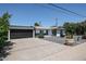 Inviting single-story home featuring a spacious driveway and meticulously landscaped front yard at 3336 E Earll Dr, Phoenix, AZ 85018