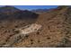 An aerial view displaying the lot and desert landscape, surrounded by mountains in the distance at 3367 N Highlands Dr # 39, Buckeye, AZ 85396