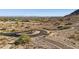 A view of the neighborhood on a desert hillside with paved cul-de-sac at 3367 N Highlands Dr # 39, Buckeye, AZ 85396