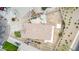 Aerial view of backyard showing patio, fire pit area and block wall fence, for enjoying the outdoor space at 36064 N Murray Grey Dr, San Tan Valley, AZ 85143