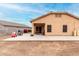 Spacious backyard with a covered patio, perfect for entertaining or relaxing outdoors at 36064 N Murray Grey Dr, San Tan Valley, AZ 85143