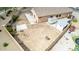 Aerial view of backyard with patio and area for outdoor relaxation and recreation, enclosed by block wall fence at 36064 N Murray Grey Dr, San Tan Valley, AZ 85143