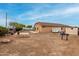 Generous backyard features a potential entertaining area with a fire pit at 36064 N Murray Grey Dr, San Tan Valley, AZ 85143