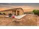 View of the spacious backyard with covered patio and large entertaining area at 36064 N Murray Grey Dr, San Tan Valley, AZ 85143