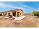 Spacious backyard with a covered patio, perfect for entertaining or relaxing outdoors at 36064 N Murray Grey Dr, San Tan Valley, AZ 85143