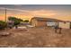 Generous backyard features a potential entertaining area with a fire pit at 36064 N Murray Grey Dr, San Tan Valley, AZ 85143