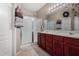 Bathroom with a double sink vanity and a glass-enclosed shower at 36064 N Murray Grey Dr, San Tan Valley, AZ 85143