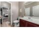 A bathroom with a commode and vanity with an entrance to a bedroom at 36064 N Murray Grey Dr, San Tan Valley, AZ 85143