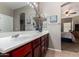 A bathroom sink features artful, decorative touches and neutral earth tones at 36064 N Murray Grey Dr, San Tan Valley, AZ 85143