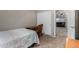 Bedroom with a bed and desk with an open doorway to living room at 36064 N Murray Grey Dr, San Tan Valley, AZ 85143