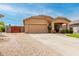 Welcoming single-level house featuring a two-car garage, inviting porch, and low-maintenance landscaping for easy living at 36064 N Murray Grey Dr, San Tan Valley, AZ 85143