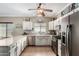 Well-lit kitchen featuring modern appliances and ample counter space at 36064 N Murray Grey Dr, San Tan Valley, AZ 85143
