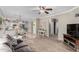 Cozy living room featuring plush carpeting and an open layout leading to the kitchen at 36064 N Murray Grey Dr, San Tan Valley, AZ 85143