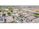 An aerial view of a residential street, highlighting the variety of homes and community layout with sidewalks and landscaping at 36064 N Murray Grey Dr, San Tan Valley, AZ 85143