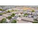 A street view highlighting the neighborhood with mature trees, sidewalks, and various housing styles in a convenient location at 36064 N Murray Grey Dr, San Tan Valley, AZ 85143