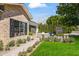 Beautiful brick home with lush landscaping, walkway and outdoor seating area at 3616 N 54Th Pl, Phoenix, AZ 85018