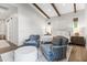 Spacious main bedroom with beamed ceiling, hardwood floors, and neutral tones for a serene retreat at 3616 N 54Th Pl, Phoenix, AZ 85018