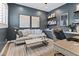 Comfortable home office with built-in shelving, stylish décor, and ample natural light at 3616 N 54Th Pl, Phoenix, AZ 85018