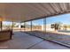 Backyard featuring a covered patio, shed, and a spacious dirt area at 3747 S Mammoth Dr, Casa Grande, AZ 85193