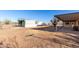 Backyard featuring a shed, a covered patio and dirt at 3747 S Mammoth Dr, Casa Grande, AZ 85193