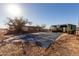 Backyard showing in-ground pool with cover, covered patio and single level home on a sunny day at 3747 S Mammoth Dr, Casa Grande, AZ 85193