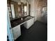 Bathroom with dual mirrors, sink and cabinets at 3747 S Mammoth Dr, Casa Grande, AZ 85193
