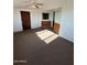 Bedroom with a ceiling fan, door, and a window at 3747 S Mammoth Dr, Casa Grande, AZ 85193