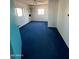 An empty bedroom with blue carpet and a ceiling fan at 3747 S Mammoth Dr, Casa Grande, AZ 85193