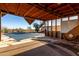 View from inside the enclosed patio looking towards a covered pool and backyard area at 3747 S Mammoth Dr, Casa Grande, AZ 85193