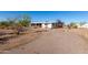 Spacious home with a driveway, featuring desert landscaping at 3747 S Mammoth Dr, Casa Grande, AZ 85193