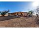 Single level home with a covered patio and neutral color scheme, set on a spacious lot at 3747 S Mammoth Dr, Casa Grande, AZ 85193