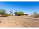 Single-story home with a large yard and a driveway at 3747 S Mammoth Dr, Casa Grande, AZ 85193