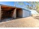Open garage area with storage shelving and view of home's exterior at 3747 S Mammoth Dr, Casa Grande, AZ 85193