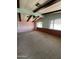View of living room with a ceiling fan, windows, and wainscoting at 3747 S Mammoth Dr, Casa Grande, AZ 85193