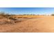 Gravel road through a vacant lot and potential building site at 3747 S Mammoth Dr, Casa Grande, AZ 85193