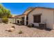 Covered patio area with patio furniture and gravel landscaping at 4262 E Sundance Ave, Gilbert, AZ 85297