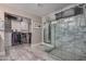 Bathroom with walk-in shower, closet with custom shelving, and neutral color palette at 4262 E Sundance Ave, Gilbert, AZ 85297