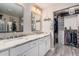 Bright bathroom with dual sinks, a walk-in closet, and great lighting at 4262 E Sundance Ave, Gilbert, AZ 85297