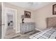 Bedroom featuring neutral walls, an accent lamp and view into another room at 4262 E Sundance Ave, Gilbert, AZ 85297
