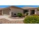 Charming home exterior with a well-maintained front yard, desert landscaping, and a two-car garage at 4262 E Sundance Ave, Gilbert, AZ 85297