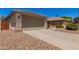 Exterior view of a two-car garage with desert landscaping and a concrete driveway at 4262 E Sundance Ave, Gilbert, AZ 85297