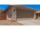 Close-up exterior of a two-car garage featuring stone accents and a spacious driveway at 4262 E Sundance Ave, Gilbert, AZ 85297
